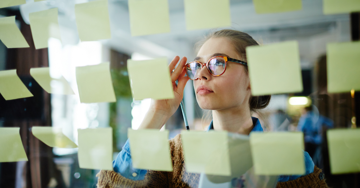 ramp up data privacy for business woman looking at map of post its planning managed service provider